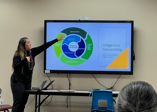 IMG_0761 instructor points at screen showing indigenous stewardship graphic