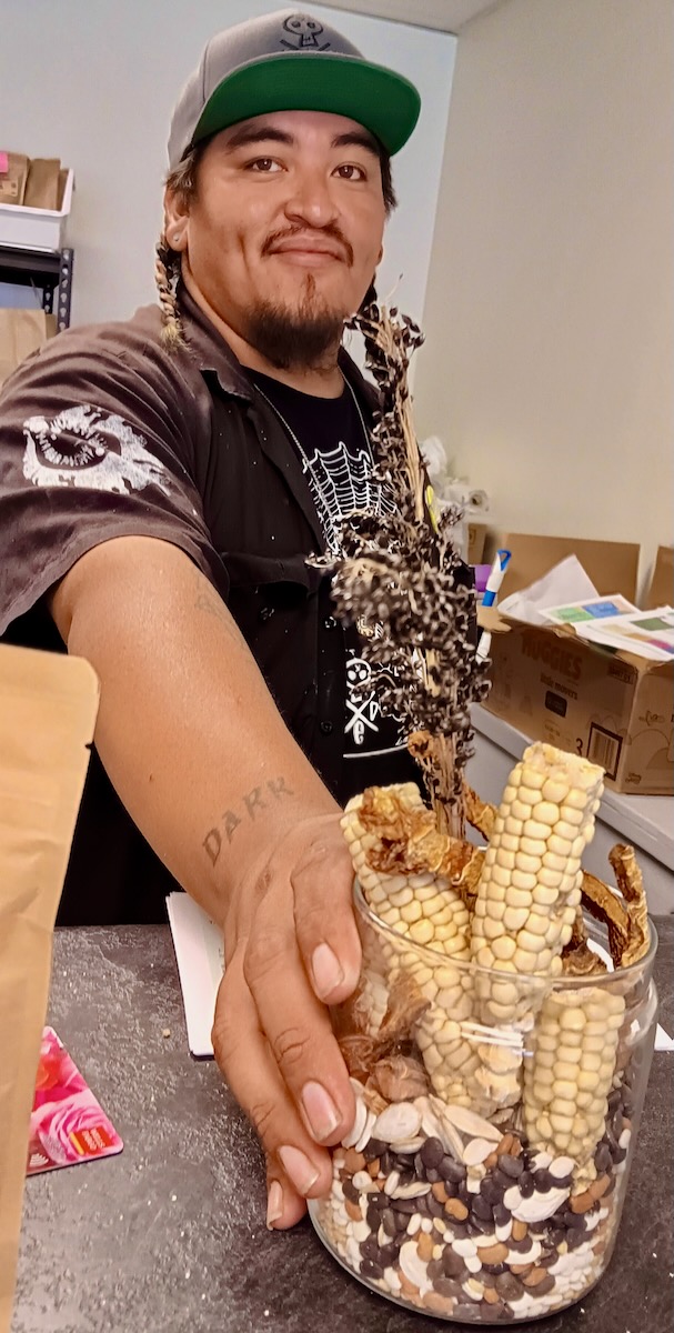 JukiPatricio Juki Patricio holds a cup of dried corn