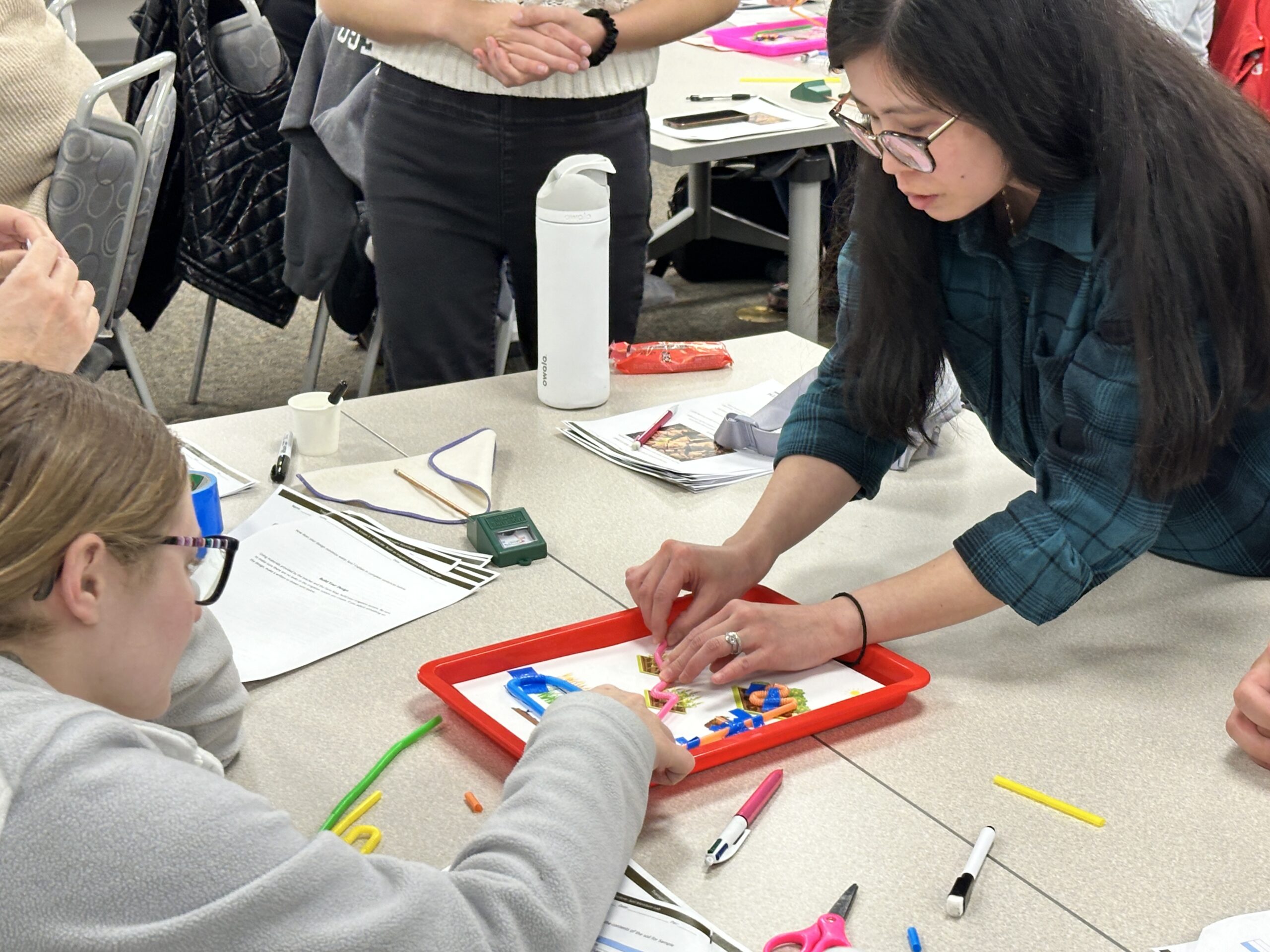 teachers practicing a hands-on teaching activity