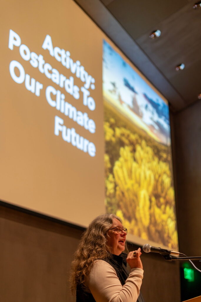 Native Resilience Program Director Maureen McCarthy leads the "Postcards to our Climate Future" activity during the 2026 NV STEAM conference.