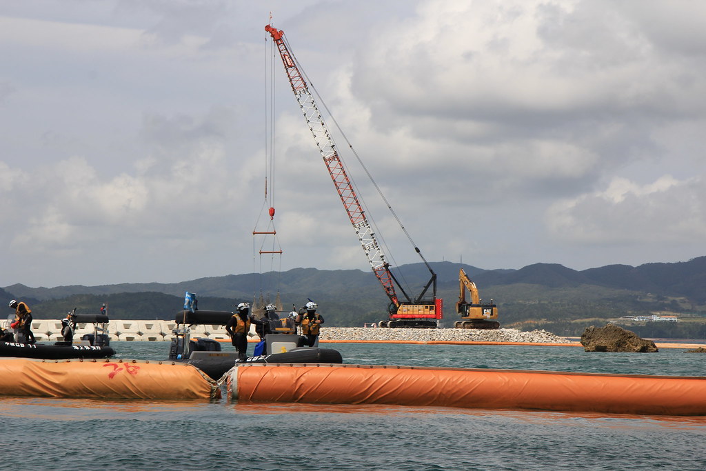 Oura Bay boats, cranes, and barriers