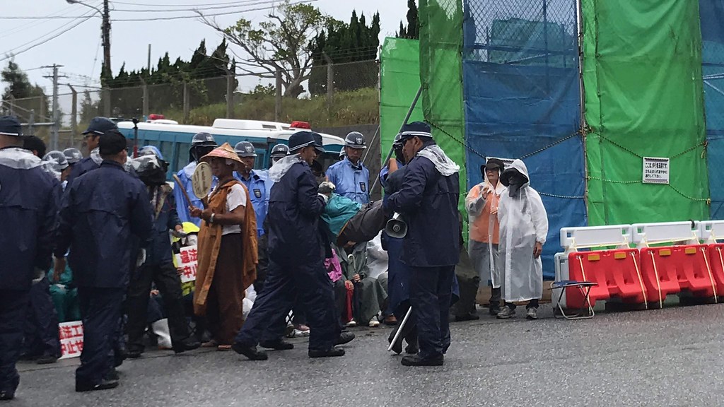 Uchinānchu elders block the entrance to Camp Schwab